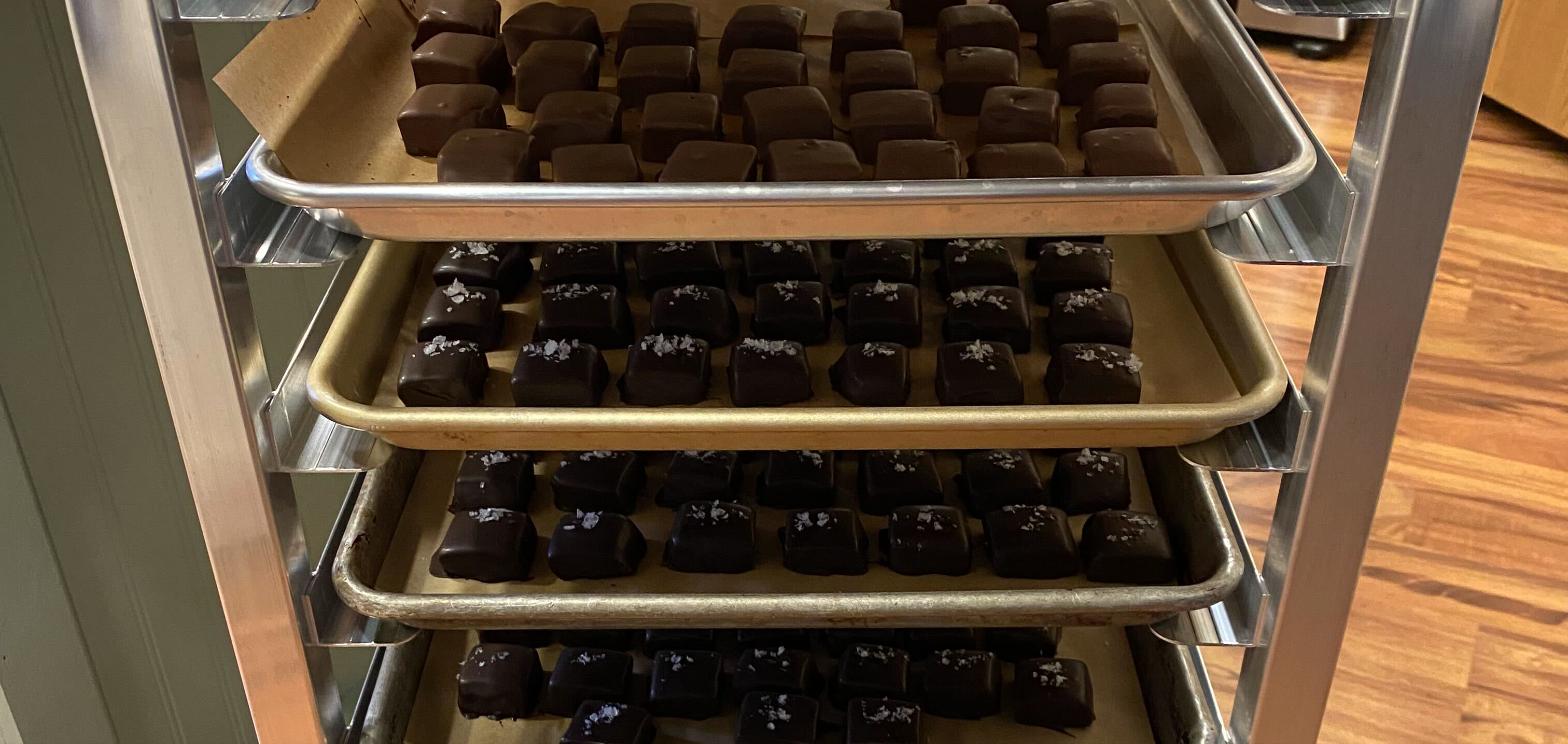 Trays of dark chocolate sea salt caramels